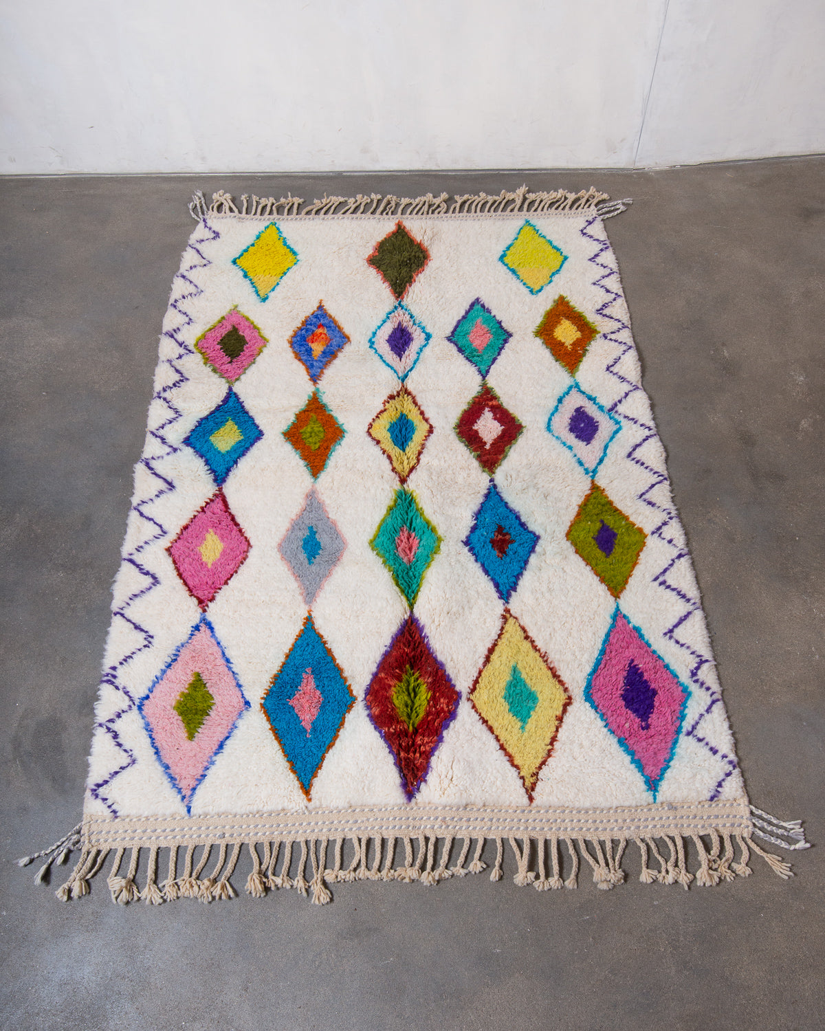 Modern, designer, handcrafted Berber rug from Morocco. Beniourain carpet with beautiful colours and patterns and fluffy wool texture.